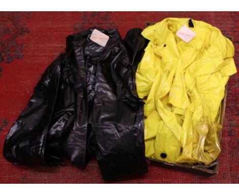 Two vintage British Rail full length water proof coats; one black the other yellow by Del Guerras of Tonyrefail, both with or