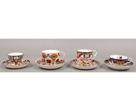 Four Royal Crown Derby cups and saucers all in the Imari design including a moustache example.