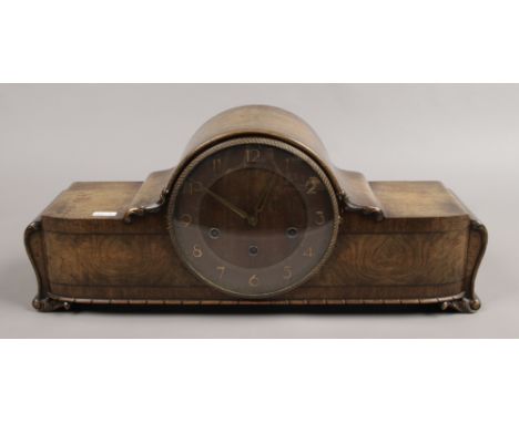 A German walnut Westminster chime mantle clock movement marked H.A.C Wurttemburg with pendulum and key.