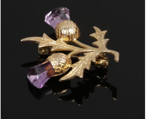A 9ct gold and amethyst thistle formed brooch.