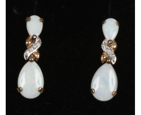 A pair of 9ct gold opal and diamond pendant earrings.