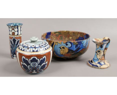 Four pieces of Bursley ware Frederick Rhead pottery to include a bowl and chamber stick in The Amstel design, vase, jar and c