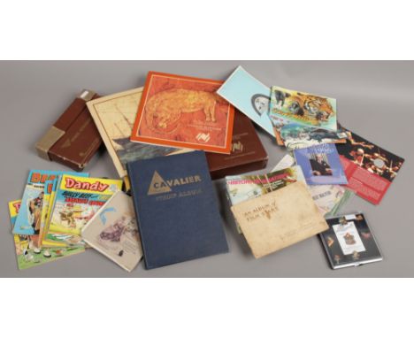 A quantity of ephemera and collectables including The Magic Roundabout enamel pin badges, tea and cigarette cards in albums, 