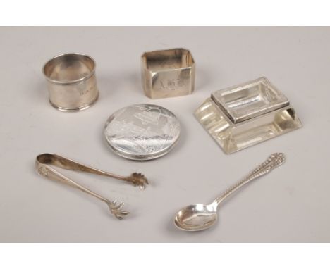 A tray of silver items including serviette rings, Bethlehem compact and sugar tongues etc.