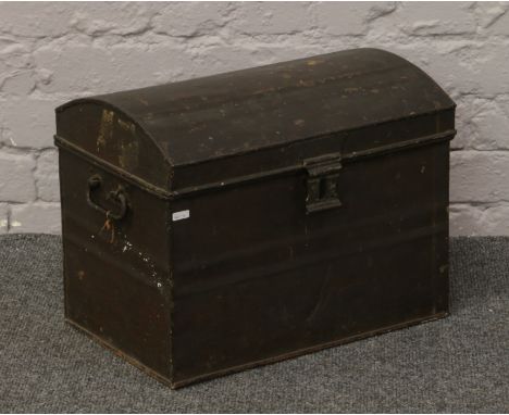 A twin handle tin trunk.