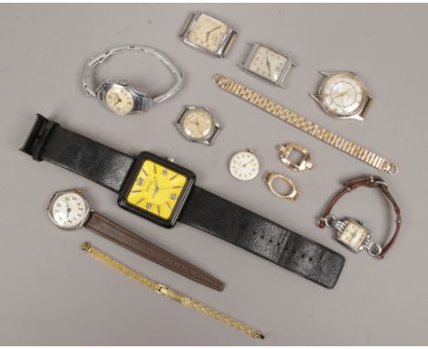 A tin of mainly vintage manual watch heads, watch parts and a Kenneth Cole designer quartz watch, vintage watches for spares 