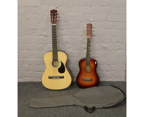 A Burswood acoustic guitar in case along with a Hohner child's guitar.