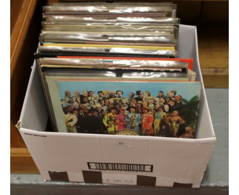 A box of L.P records to include Beatles, Rolling Stones, Glen Campbell, Cat Stevens etc.