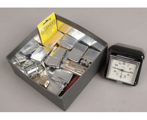 A box of lighters to also include folding USSR Slava alarm clock.