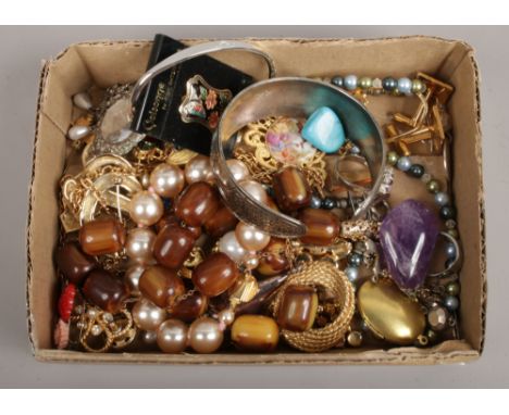 A box of costume jewellery to include cufflinks, white metal bangle, rings etc.