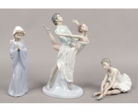 Three Nao figurines, dancing ballet group, seated ballet girl and a girl praying.