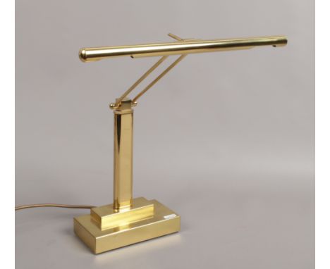 A modern brass effect desk lamp.