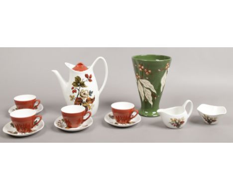 A vintage Midwinter fashion shape coffee set in the Winter Rose design including coffee pot, cream jug, sugar bowl and four d