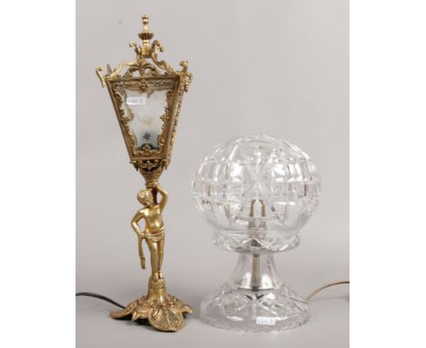 A cut glass table lamp, along with a gilt figural table lamp the shade in the form of a lantern.