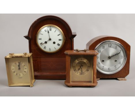 A mahogany cased dome top mantle clock with French movement along with a similar British example and two quartz clocks in nee