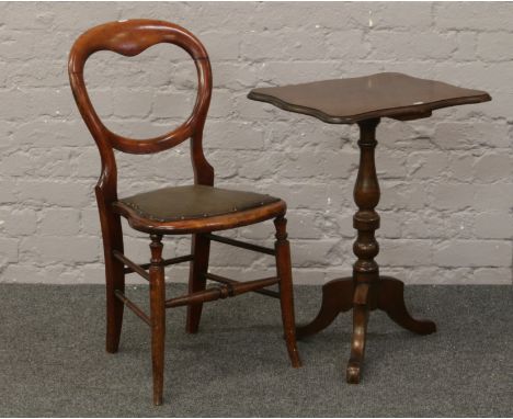 A mahogany balloon back chair, along with a Victorian mahogany tripod wine table (in need of repair).