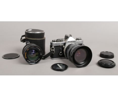 An Olympus OM-1 35mm SLR camera body, along with Tamron Tele-Macro 28-70mm and Mitakon Macro 24mm lenses and Olympus body and