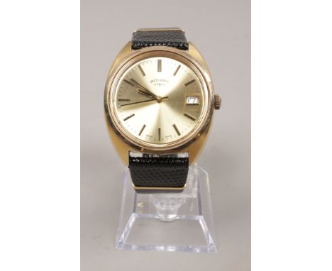 A gents yellow metal Rotary manual wristwatch with date display, centre seconds and applied baton markers.