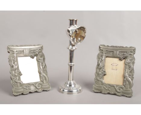 An early 20th century chrome plated candle reading lamp, along with a pair of Chinese pewter eizel frames, c1900.