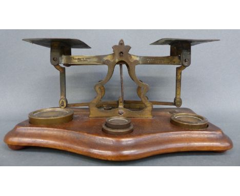 A set of T J Smith & Son, London postal scales with weights and letter rates to pan, length 20cm