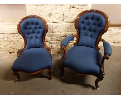 A Victorian mahogany spoon back armchair with button back and serpentine front raised on carved gnurled legs and ceramic cast