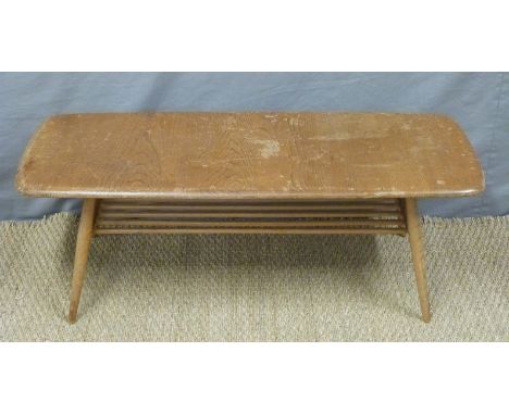 A light elm Ercol coffee table with stick style undershelf, H39 x W106 x D45cm