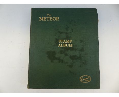 A Meteor stamp album of mint and used Commonwealth stamps, Nyasaland stamp and a modern album