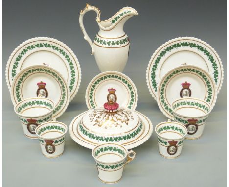 A collection of early 19thC armorial porcelain by Chamberlains, Worcester, with griffin crest and motto 'Gloria Quo Coelum Qu
