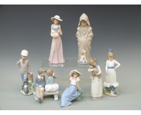 Seven Nao figures of children with animals or birds and sweethearts, tallest 26cm