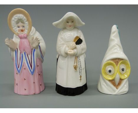 Three candle snuffers, two by Royal Worcester, owl and nun, and another of an old woman, unmarked, largest approximately 10.2