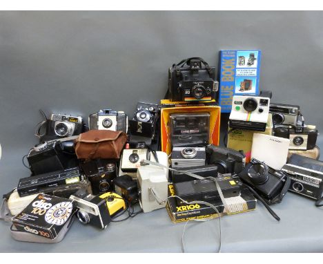 A quantity of collectable cameras to include Polaroid and other instant cameras, folding examples etc
