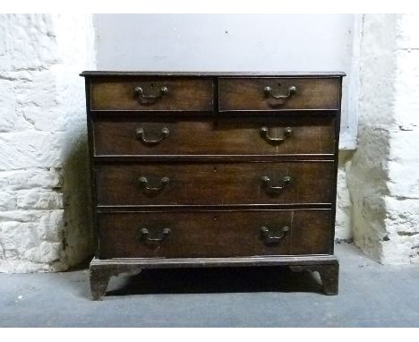 A Georgian mahogany chest of two over three graduated drawers raised on bracket feet, H100 x W110 x D55cm
