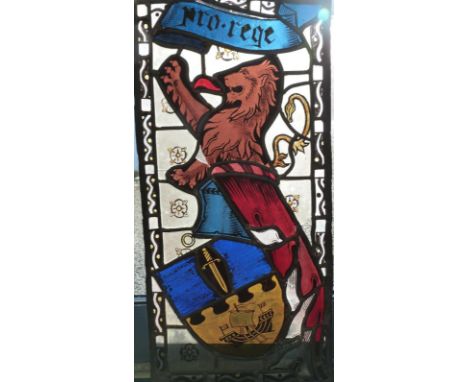A mid-20thC stained glass window depicting rampant lion, shield and 'pro-rege', 31cm x 63cm, made by local artist Michael Haw