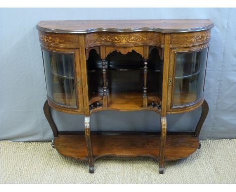 A 19thC bow fronted rosewood sideboard with glazed display cabinets and galleried shelf to centre, H102 x W116 x D36cm