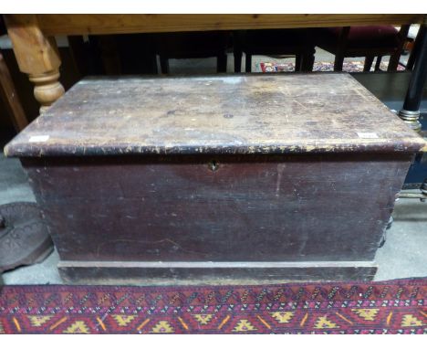 A 19thC stained pine trunk with candle box, H49 x W90 x D50cm
