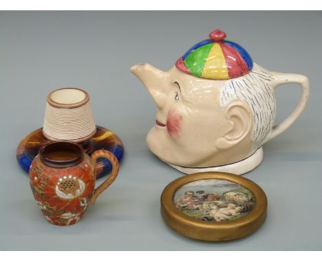 A collection of ceramics including Doulton Lambeth jug, Prattware 'Peace' pot lid, Wedgwood tortoiseshell glazed match strike