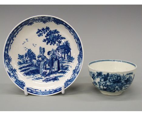 First period Worcester footed tea bowl and saucer, the saucer decorated in the Milkmaids pattern with blue crescent mark to b