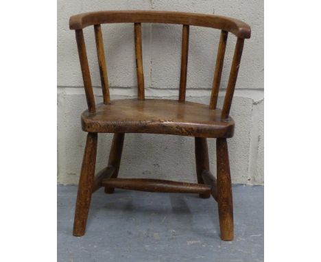 A 19thC elm seated child's stick back country style chair