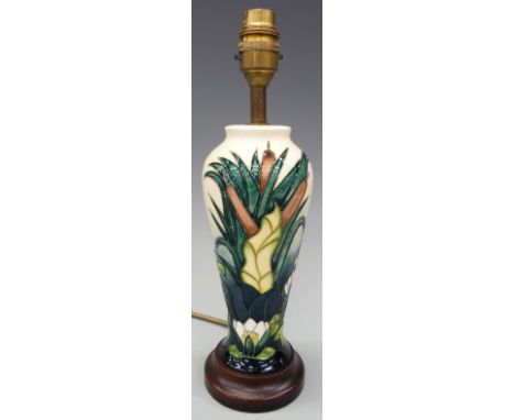 Moorcroft lamp base decorated with lilies in the Lamia pattern, 32cm tall 