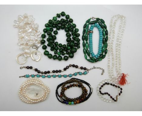 A garnet and pearl bracelet, a rock crystal necklace, two pearl necklaces, tiger's eye bracelet, two malachite necklace etc