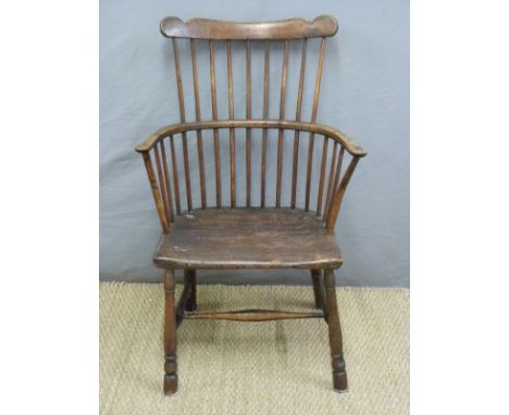 An 18th/19thC elm seated stick back Windsor armchair