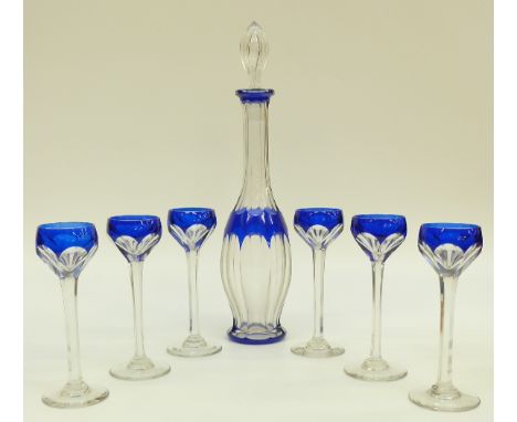 Attributed to Baccarat, flash overlaid cut glass cordial set, the decanter and six glasses with blue overlay over clear groun