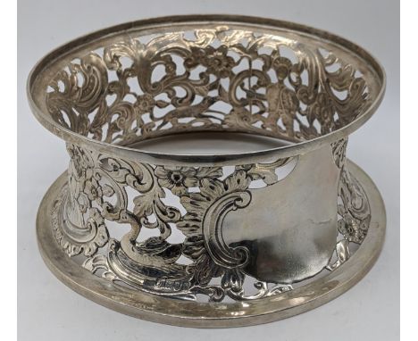 An Edwardian silver potato ring, decorated with flora and fauna and figures, vacant cartouche, hallmarked London, 1903, 320g,