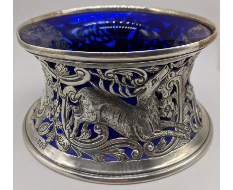 An early 20th century Irish silver potato ring, embossed decoration of flora and fauna, hallmarked Dublin 1932, maker Weir &a