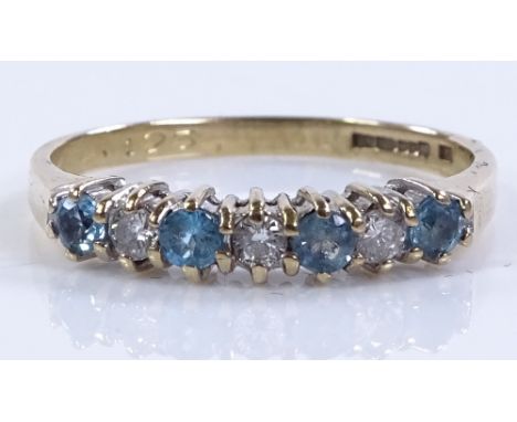 A 9ct gold blue topaz and diamond half hoop ring, size O, 1.8g