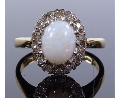 An 18ct gold opal and diamond cluster ring, setting height 13.8mm, size O, 5.8g