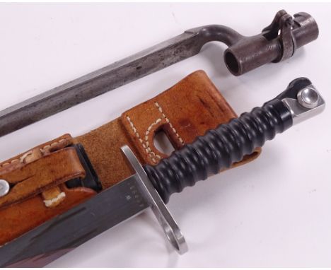 A Swiss Sig 57 bayonet, with scabbard and leather frog, and a Martini Henry 1876 pattern bayonet (2)