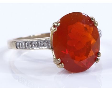 A 9ct gold fire opal and diamond ring, opal approx 2.76cts, size Q, 2.9g