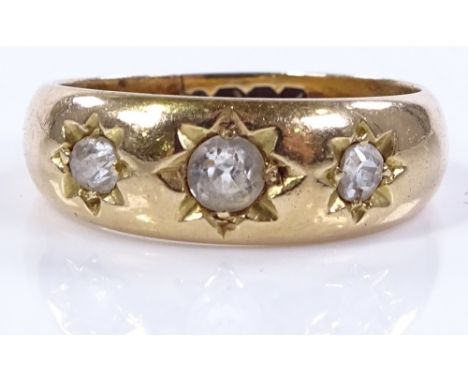 An 18ct gold 3-stone diamond gypsy ring, central diamond approx 0.18cts, setting height 6.5mm, size L, 4.7g