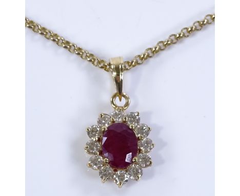 A 14ct gold ruby and diamond cluster pendant, on 9ct chain, chain length 40cm, 10.4g